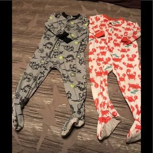 Two zip up footie toddler pajamas. Worn condition
